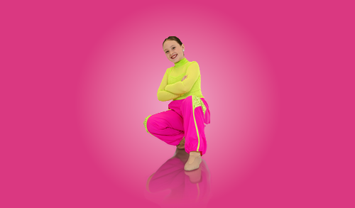 Dancer in yellow-toned stage lighting